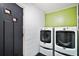 Convenient laundry room with modern washer and dryer units, and ample space at 803 N Shore Dr, Leesburg, FL 34748