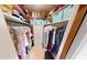 Organized walk-in closet with ample shelving, hanging space, and storage solutions at 803 N Shore Dr, Leesburg, FL 34748