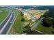 Aerial view of new construction homes and vacant lots off a highway with convenient access at 804 Pointe Emerson Blvd, Apopka, FL 32703