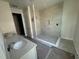Modern bathroom with double vanity, walk-in shower, and tile flooring at 804 Pointe Emerson Blvd, Apopka, FL 32703