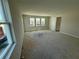 Bright and airy bedroom with three windows offering natural light and outdoor views at 804 Pointe Emerson Blvd, Apopka, FL 32703