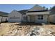 Charming single-story home featuring a two-car garage, craftsman architecture, and covered porch at 804 Pointe Emerson Blvd, Apopka, FL 32703