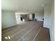 Open-concept living room leading into a modern kitchen with an island at 804 Pointe Emerson Blvd, Apopka, FL 32703