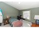 Cozy bedroom with natural light and a comfortable bed at 858 Grand Regency Pt # 201, Altamonte Springs, FL 32714