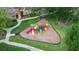 Community playground with colorful equipment and a wood chip surface at 858 Grand Regency Pt # 201, Altamonte Springs, FL 32714