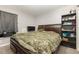 Bedroom with dark wood furniture and carpet flooring at 9532 Water Fern Cir, Clermont, FL 34711