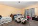 Bedroom with a ceiling fan and carpet flooring at 9532 Water Fern Cir, Clermont, FL 34711