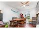 A view of the dining room featuring hardwood floors, and a wooden dining table at 9532 Water Fern Cir, Clermont, FL 34711