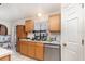 Kitchen features stainless steel appliances and light wood cabinets at 9532 Water Fern Cir, Clermont, FL 34711