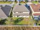 Aerial view of landscaped backyard featuring a well-maintained fence at 10024 John Adams Way, Orlando, FL 32817