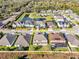 Aerial view of home in residential community, featuring a pond at 10024 John Adams Way, Orlando, FL 32817