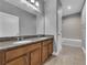 Bathroom featuring a double sink vanity with granite countertops and tiled floors, with a separate shower and tub at 10024 John Adams Way, Orlando, FL 32817