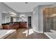 Bathroom featuring dual sinks, granite countertop, tub and tiled shower stall at 10024 John Adams Way, Orlando, FL 32817