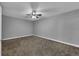 Neutral bedroom featuring neutral walls, plush carpeting, and a modern ceiling fan at 10024 John Adams Way, Orlando, FL 32817