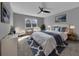 Staged bedroom with accent rugs, throw blanket and pillows, plants, and wall art at 10024 John Adams Way, Orlando, FL 32817