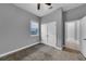 This bedroom features a window, closet, and neutral carpet at 10024 John Adams Way, Orlando, FL 32817