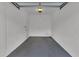 A clean, empty garage with a sealed floor and bright lighting at 10024 John Adams Way, Orlando, FL 32817