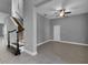 Living room with a ceiling fan and stairs at 10024 John Adams Way, Orlando, FL 32817