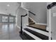 Staircase with carpet and white and black trim at 10024 John Adams Way, Orlando, FL 32817