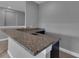 Close-up of a wet bar area featuring granite countertops and modern fixtures at 10024 John Adams Way, Orlando, FL 32817