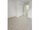 Carpeted bedroom featuring a closet with white doors, offering ample storage at 1004 Travertine Ter, Sanford, FL 32771