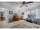 Cozy bedroom featuring a ceiling fan, and a window illuminating the space with natural light at 10809 Oak Glen Cir, Orlando, FL 32817