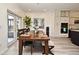 Bright dining room with a dining table, with views of the outdoor patio and kitchen at 1215 Castleport Rd, Winter Garden, FL 34787