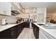 Stylish kitchen featuring quartz countertops, stainless steel appliances, and bright modern cabinetry at 1215 Castleport Rd, Winter Garden, FL 34787