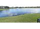 Beautiful lake view on the property with a fountain, enhancing the natural landscape and adding a serene touch at 1215 Castleport Rd, Winter Garden, FL 34787