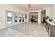 Living room showcasing open floor plan, patio doors, and wood-style flooring at 1215 Castleport Rd, Winter Garden, FL 34787