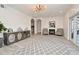 A bright living room with a fireplace, modern lighting, and wood-style flooring at 1215 Castleport Rd, Winter Garden, FL 34787