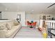 Bright loft with light gray vinyl floors and beige sofa at 1215 Castleport Rd, Winter Garden, FL 34787