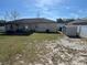 Large backyard with white fencing, storage shed, and ample space for outdoor enjoyment at 12927 Montana Woods Ln, Orlando, FL 32824