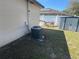 A view of the home's side yard and AC unit, and a glimpse of the fenced-in backyard at 12927 Montana Woods Ln, Orlando, FL 32824