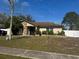 Charming single-story home with stone accents and manicured front yard landscaping at 12927 Montana Woods Ln, Orlando, FL 32824