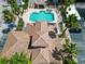 Aerial view of the community pool, showcasing its size, surrounding amenities, and well-manicured landscape at 13500 Turtle Marsh Loop # 816, Orlando, FL 32837