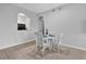 Dining room with a white table and four chairs near the kitchen at 13500 Turtle Marsh Loop # 816, Orlando, FL 32837