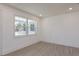 Well-lit bedroom featuring wood-look tile floors and a large window with trim at 1518 Fabian Ave, Orlando, FL 32807