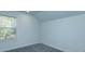 Empty bedroom with carpeted floors and a window providing natural light at 1518 Fabian Ave, Orlando, FL 32807