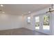 Bright, open living room with sliding glass doors and wood-look tile floors at 1518 Fabian Ave, Orlando, FL 32807