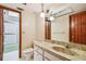 Well-lit bathroom featuring vanity and a shower with glass door at 1606 The Oaks Dr, Maitland, FL 32751