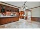 Traditional kitchen featuring custom cabinetry, tile flooring, and granite countertops at 1606 The Oaks Dr, Maitland, FL 32751