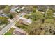 Aerial view of a charming home with brick walkway, well-manicured yard, and a tree-lined street at 1920 S Palmetto Ave, Sanford, FL 32771