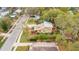 Aerial view showing mature trees around a home, landscaped yard and neighborhood streets at 1920 S Palmetto Ave, Sanford, FL 32771