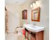 Full bathroom featuring a vanity, toilet and tiled shower with curtain at 1920 S Palmetto Ave, Sanford, FL 32771