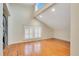 Empty room with hardwood floors, a laundry and a shuttered window at 1920 S Palmetto Ave, Sanford, FL 32771