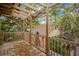 Wooden deck featuring wooden posts and a view of the surrounding neighborhood at 1920 S Palmetto Ave, Sanford, FL 32771