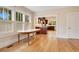 Elegant dining area with hardwood floors, a classic table, and direct access to the kitchen at 1920 S Palmetto Ave, Sanford, FL 32771