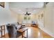 Cozy living room featuring hardwood floors, natural light, comfortable seating and modern entertainment setup at 1920 S Palmetto Ave, Sanford, FL 32771