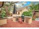 Outdoor kitchen area with a grill, sink, and seating, perfect for entertaining at 1920 S Palmetto Ave, Sanford, FL 32771